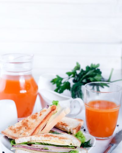 Breakfast with sandwich and orange juice, space for text